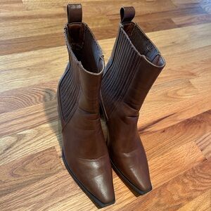 Elegant Brown Heeled Boots with Polished Finish